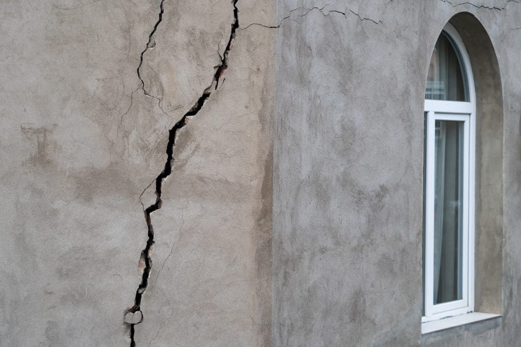 Closeup of cracked wall of house destroyed during strong earthquake in Tbilisi Georgia. Damage on buiding.