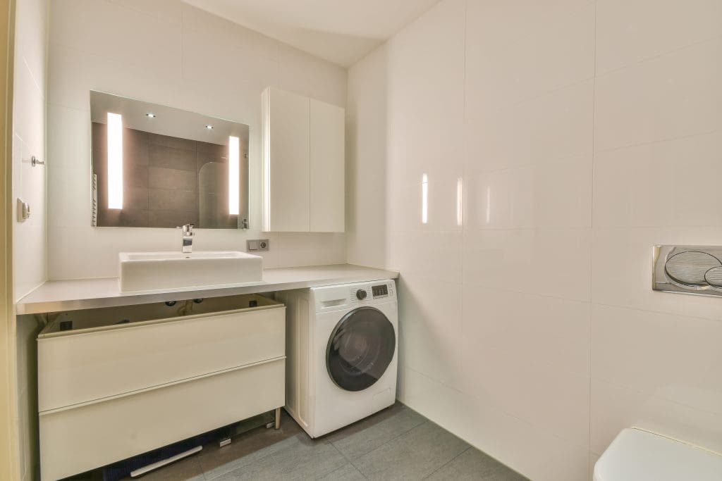 laundry room converted to include a bathroom. one of three ways to add a bathroom to your home.  