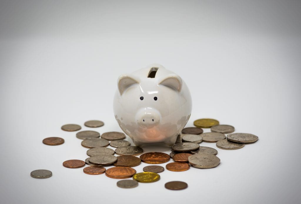 Piggy bank on pile of coins