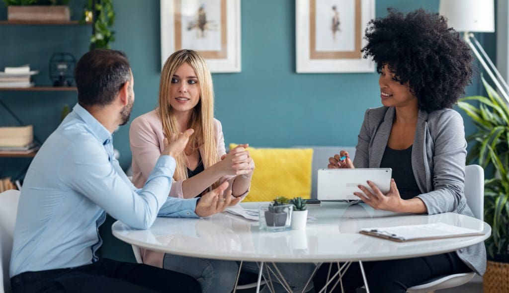 Real estate agent working with couple to find their new home