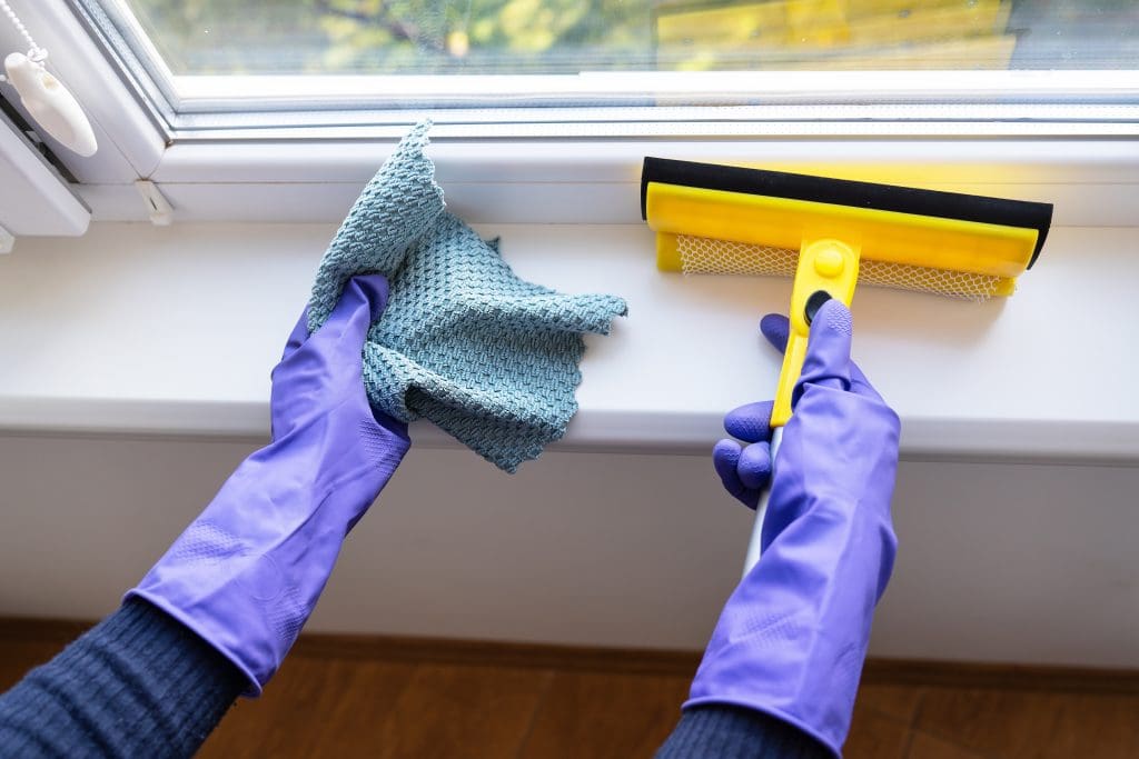 Cleaning windows, concept of cleaning tips when listing home. 