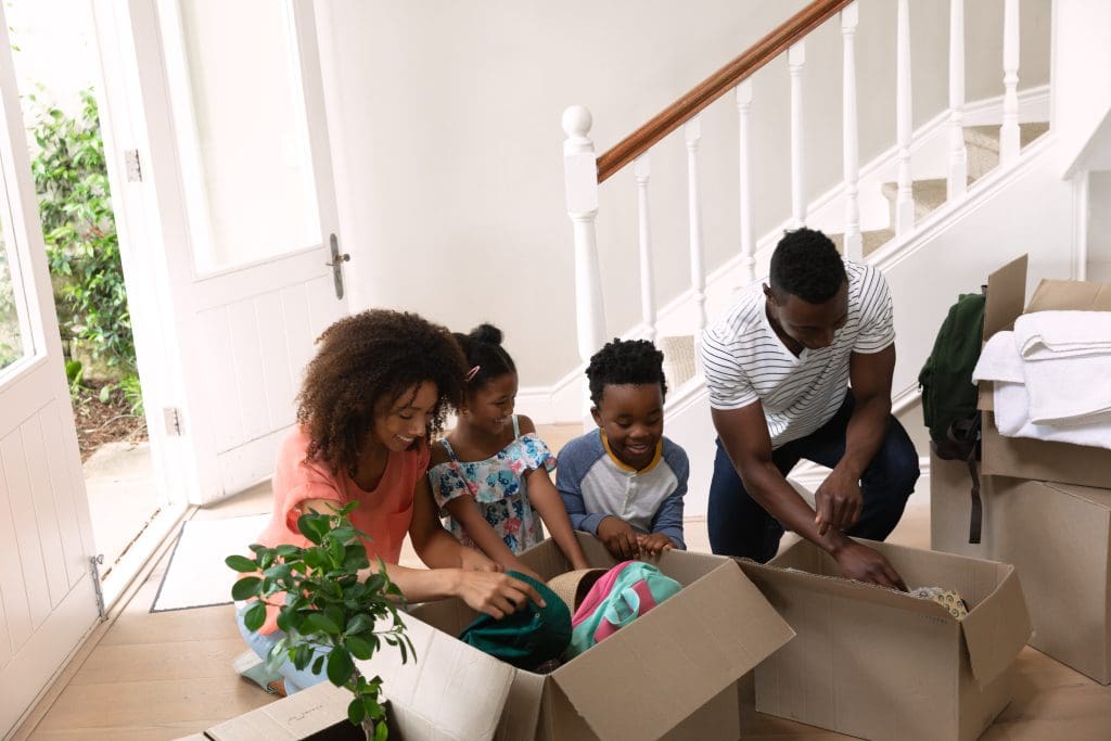 5 Questions Sellers Should Ask Potential Buyers. Family packing belongings to move. 