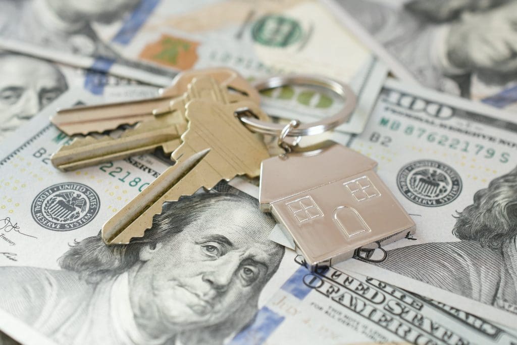 FHA loan closing costs.  Bills with keys on top.