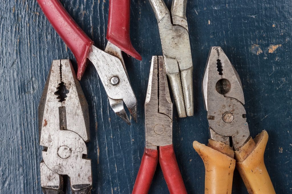 New Homeowner?  10 Must-Have Tools for Home Maintenance.  Pliers on a wooden background