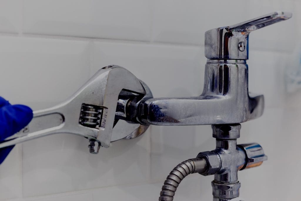 How to Fix and Prevent Water Leaks in Your Home.  Pipe wrench used to fix leak